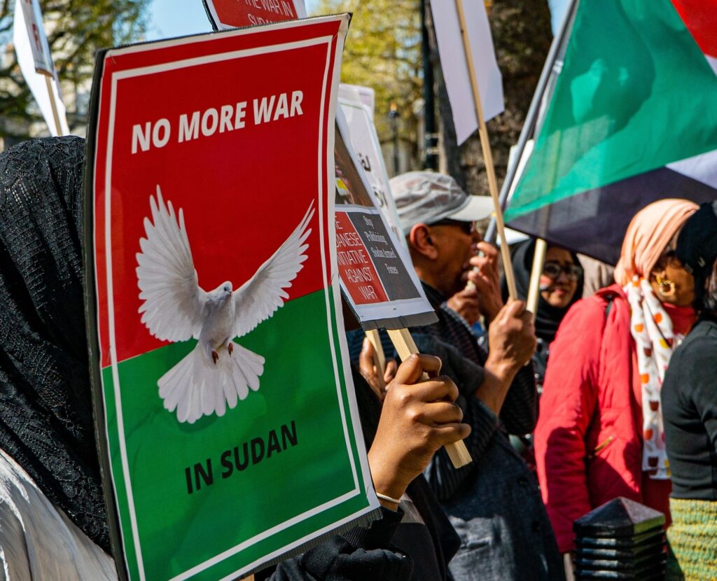 A sign at a protest that reads 'No more war in Sudan'