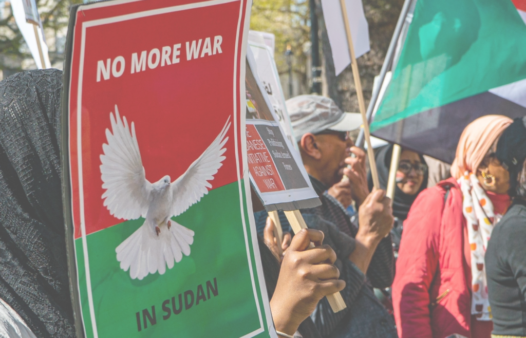A sign at a protest that reads 'No more war in Sudan'