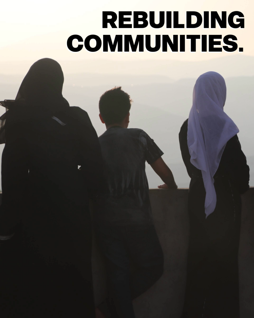 3 people looking out across mountains, quote reads 'rebuilding communities'