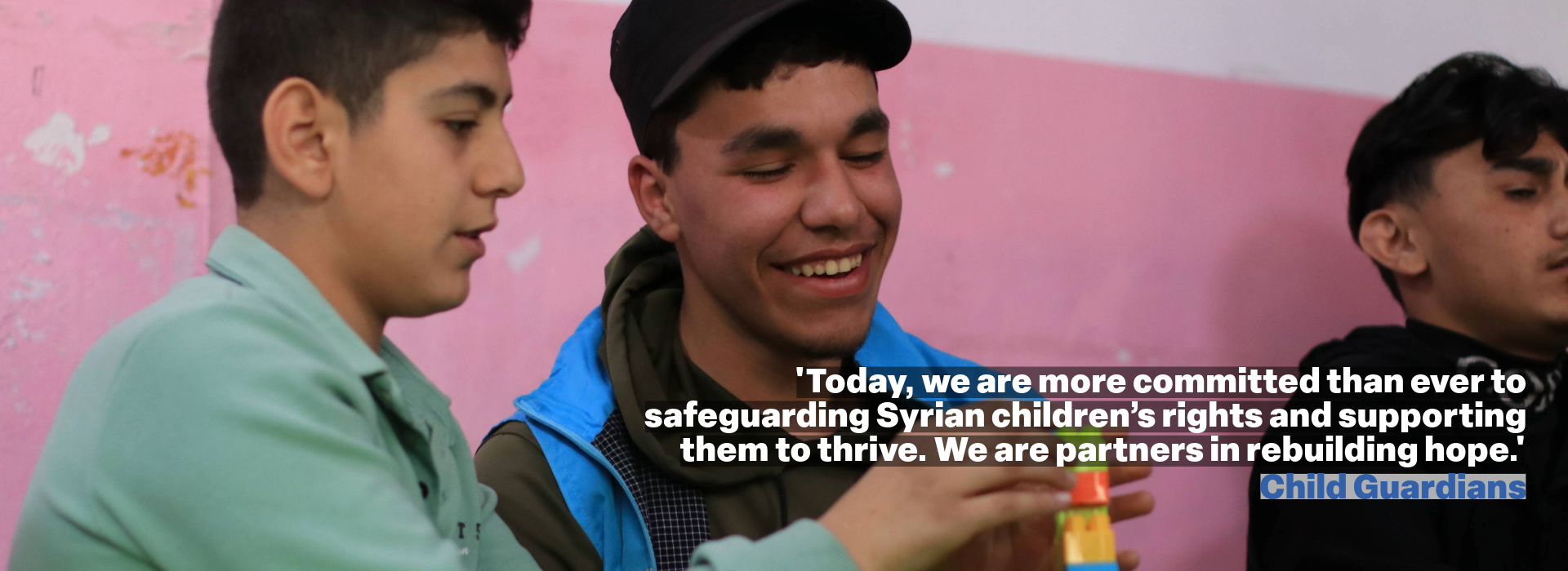 Two children in a classroom quote reads ''Today, we are more committed than ever to safeguarding Syrian children’s rights and supporting them to thrive. We are partners in rebuilding hope.' Child Guardians