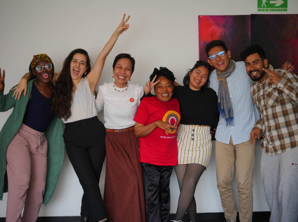 A group of people smiling and looking at the camera